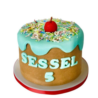 Colorful personalized dog birthday pupcake decorated with sprinkles and a cherry for a special celebration.