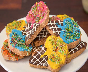 Colorful ice cream dog cookies in various shapes and colors, perfect for pampering your furry friend.