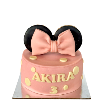 Delicious pink mouse dog cake with ears and bow tie, perfect for celebrating your pup's special day!