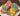 Colorful ice cream dog cookies in various shapes and colors, perfect for pampering your furry friend.